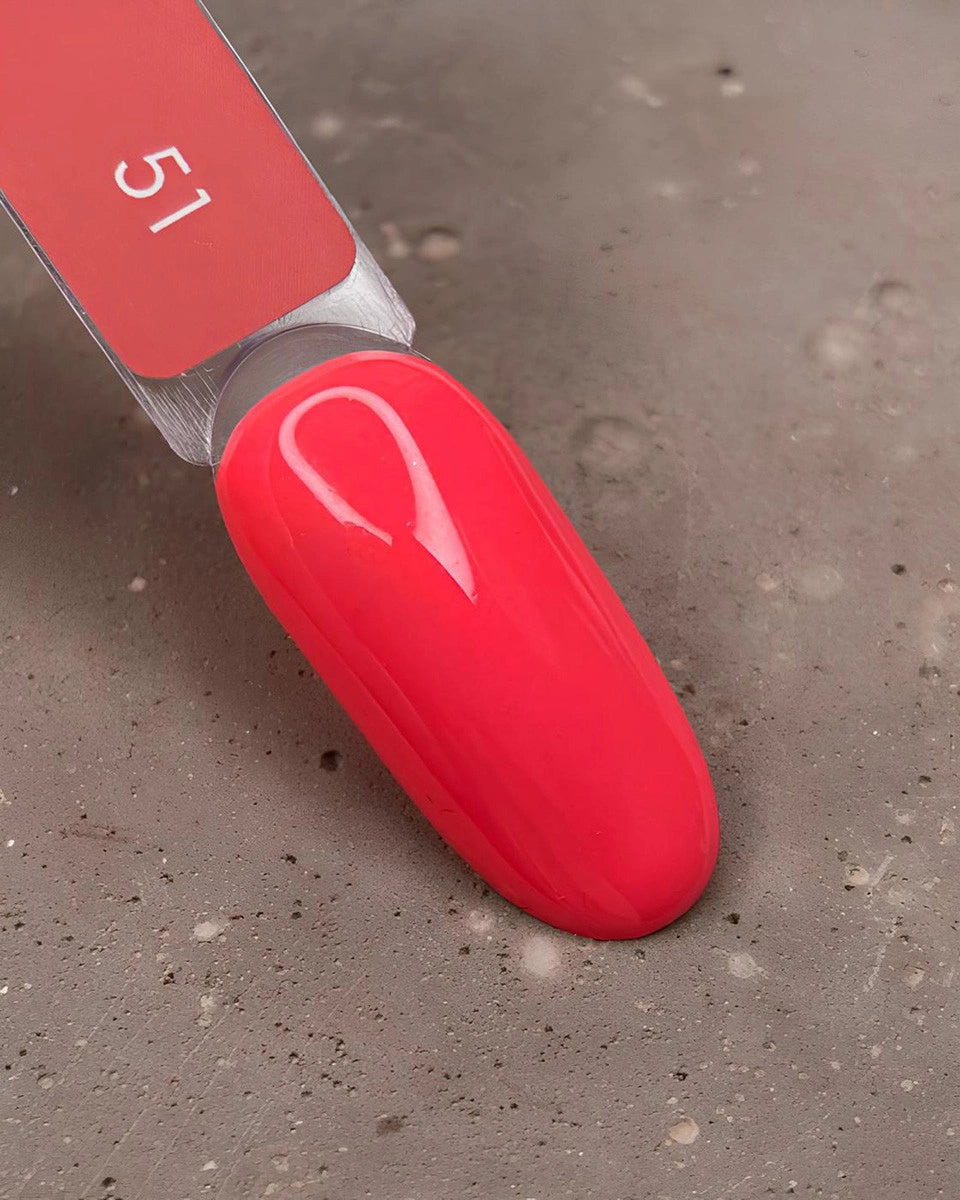 Red nail polish with a gray background